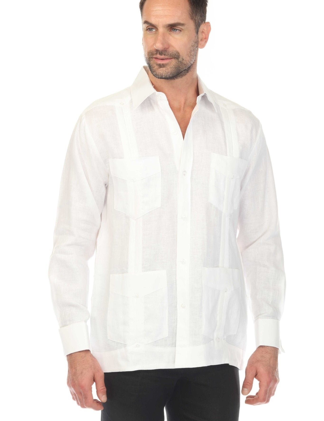 Man wearing a white 100% linen classic four-pocket long sleeve guayabera with black trousers