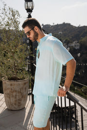 Camisa playera de manga corta con botones y ribete plisado para hombre