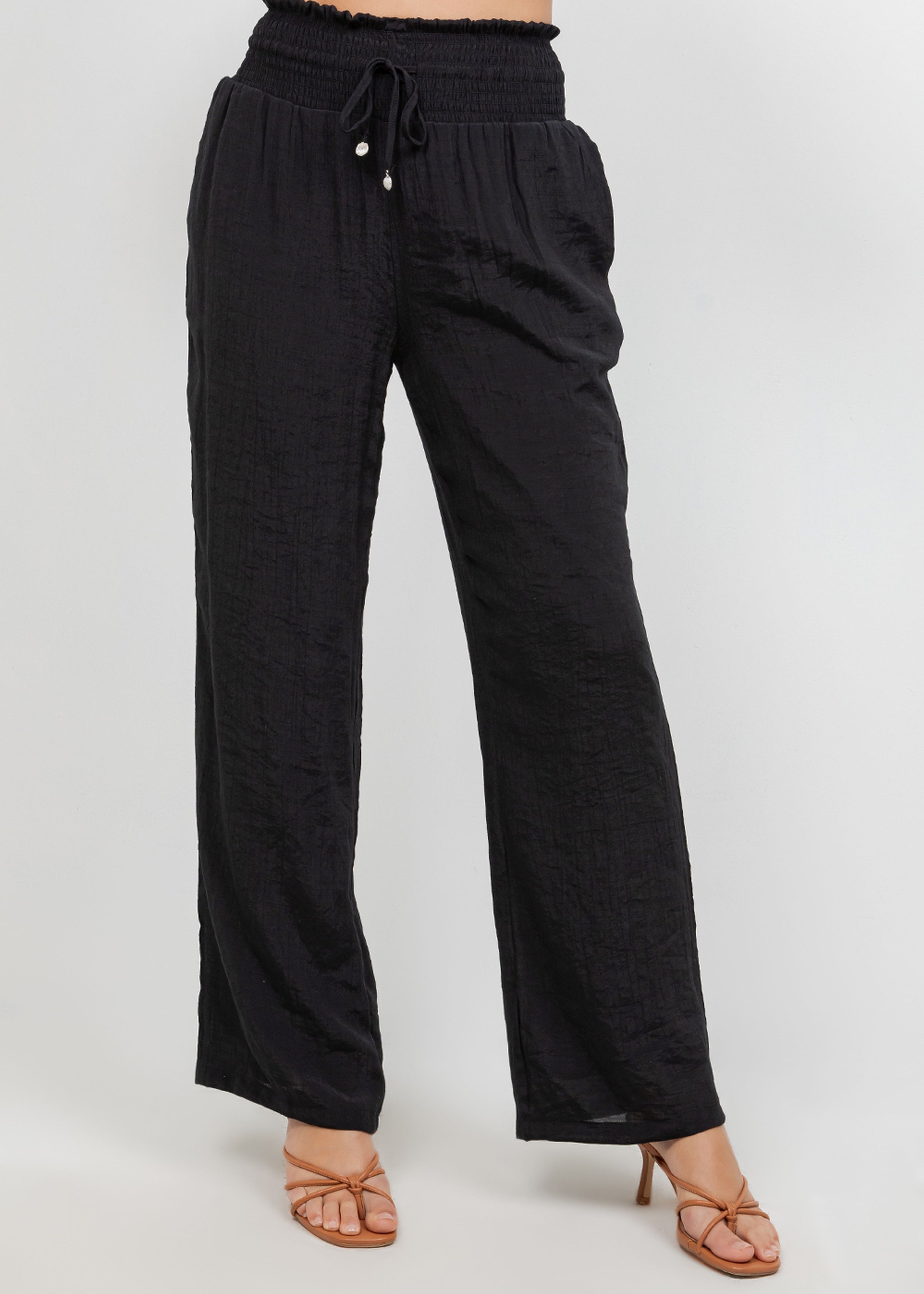 Front view of Ladies Smocked Waist Drawstring Palazzo Pants in black, showing smocked waist detail.
