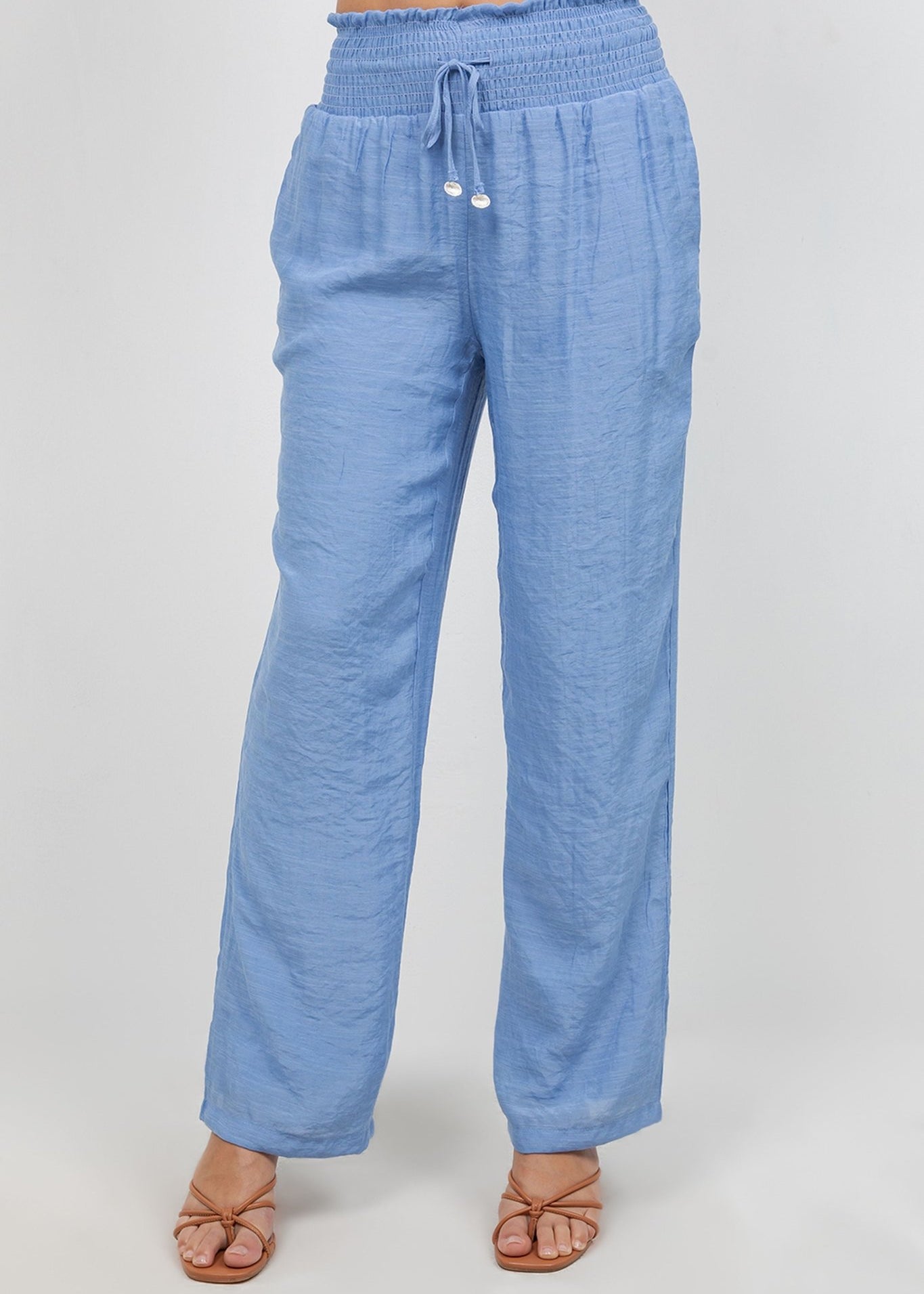 Front view of light blue Ladies Smocked Waist Drawstring Palazzo Pants with smocked waist detail.