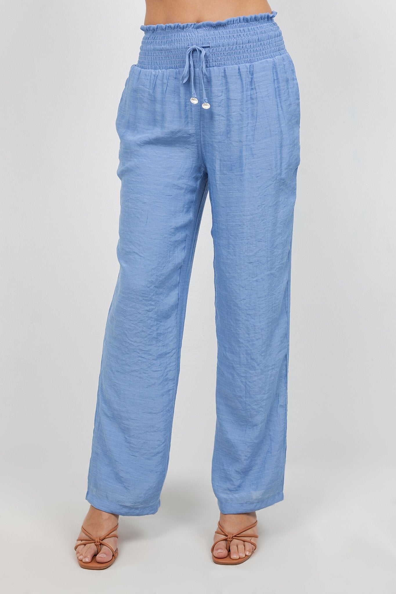 Front view of light blue Ladies Smocked Waist Drawstring Palazzo Pants with smocked waist detail.