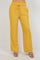 Front view of model wearing yellow Ladies Smocked Waist Drawstring Palazzo Pants with heeled sandals.