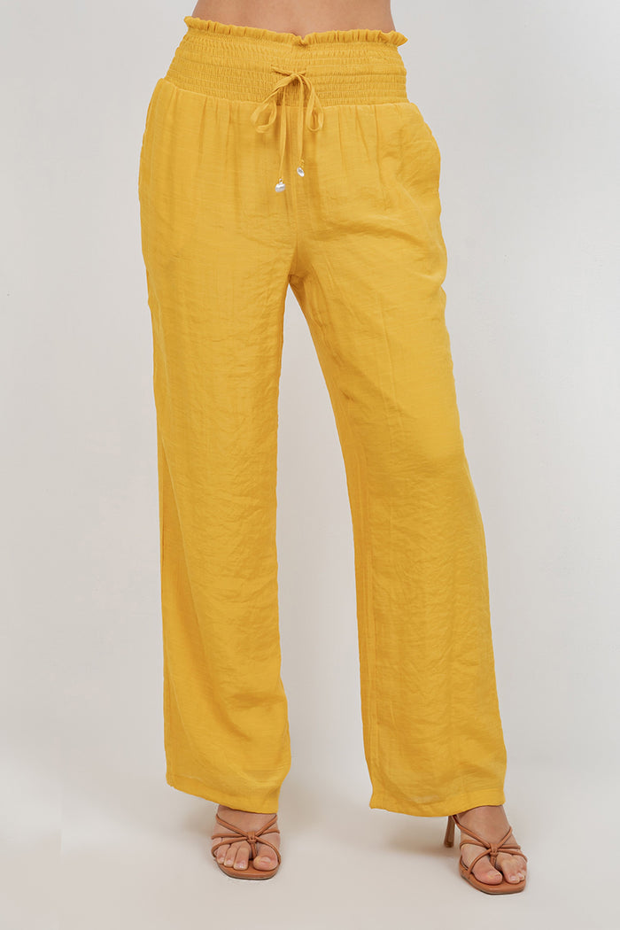 Front view of Ladies Smocked Waist Drawstring Palazzo Pants in white, with smocked waist detail.
