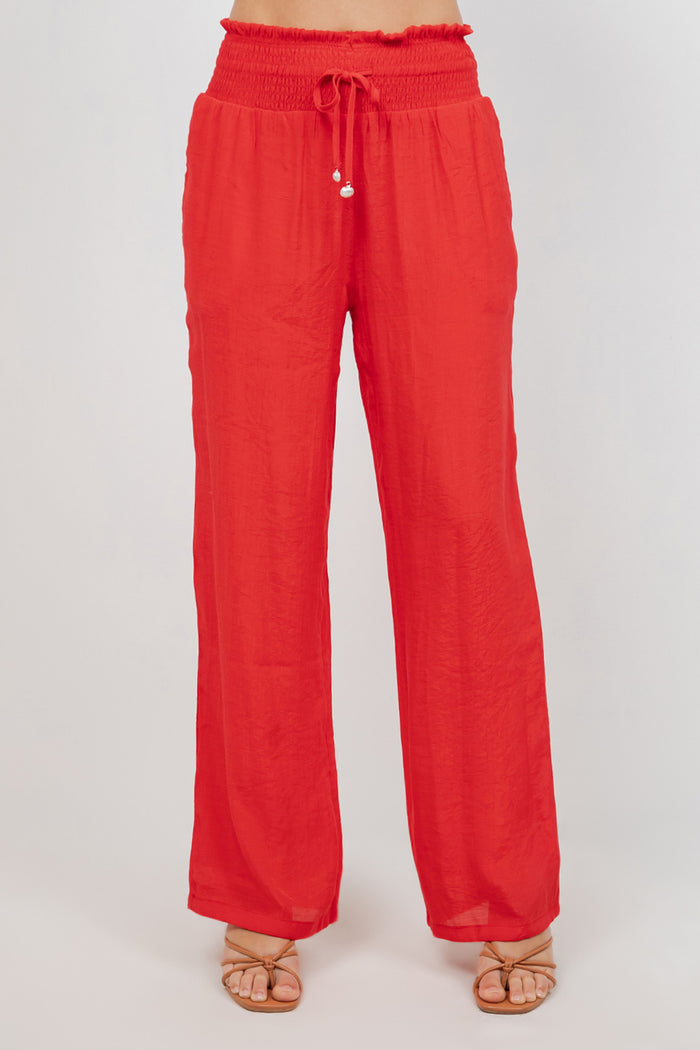 Front view of Ladies Smocked Waist Drawstring Palazzo Pants in white, with smocked waist detail.