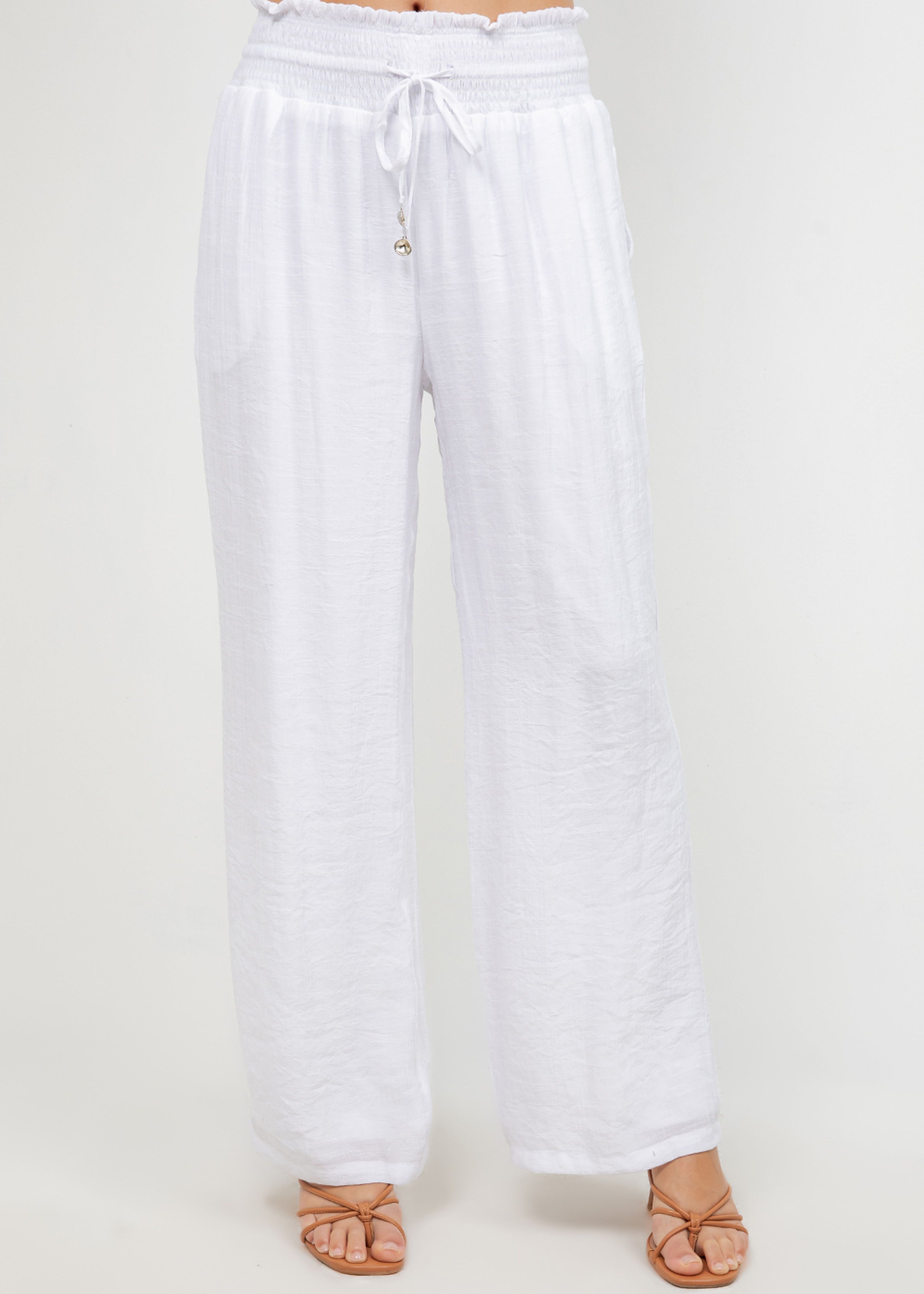 Front view of Ladies Smocked Waist Drawstring Palazzo Pants in white, with smocked waist detail.