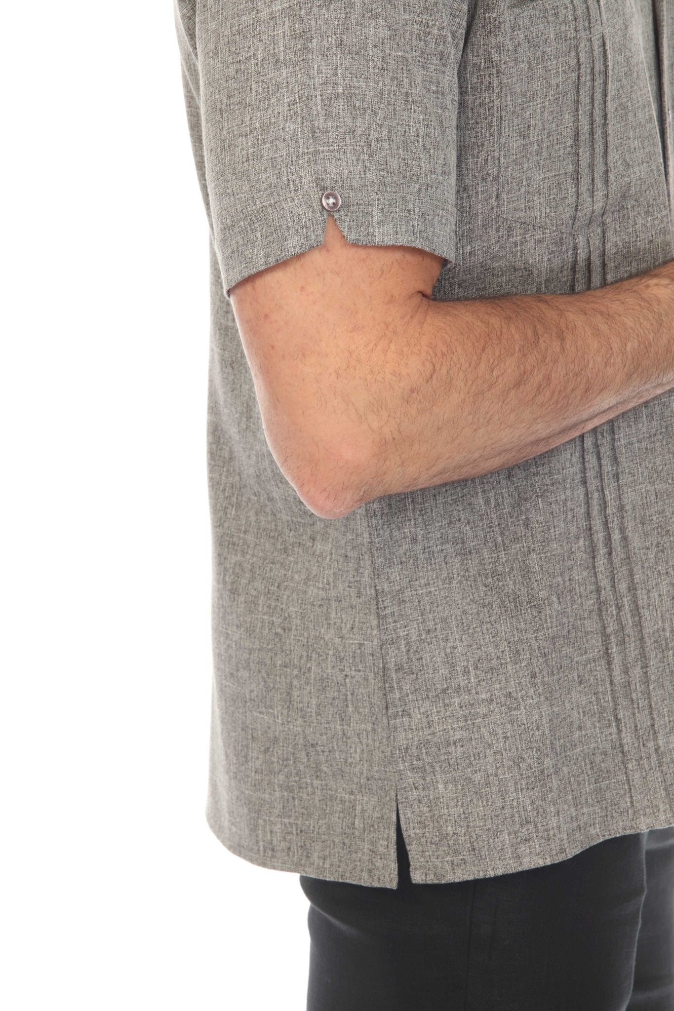 Close up side view of a grey Men’s Classic Two-Pocket Guayamisa Shirt with Pleats showing the sleeve detail.
