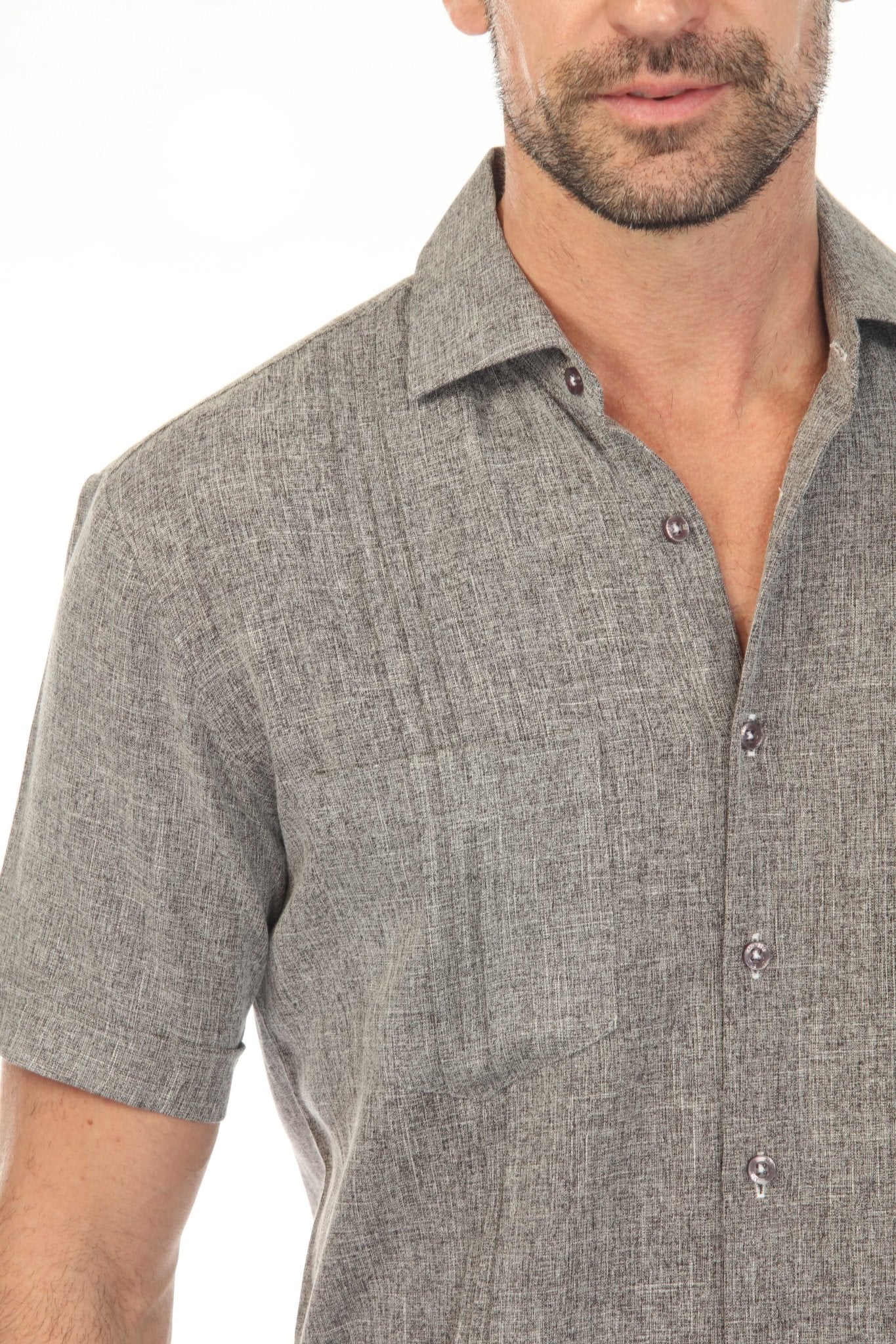 Close-up of a grey Men’s Classic Two-Pocket Guayamisa Shirt showing the pocket and button details.