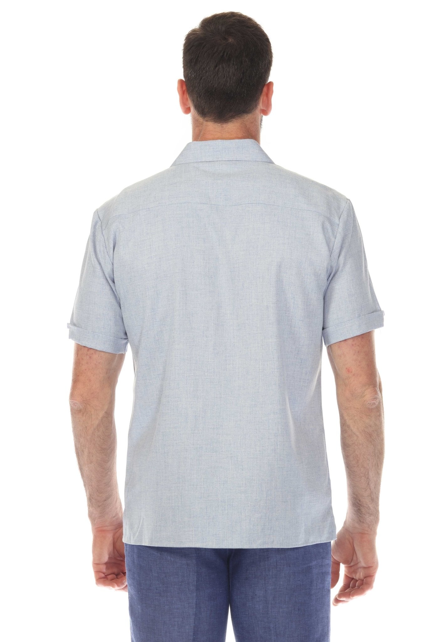 Back view of a light blue Men’s Classic Two-Pocket Guayamisa Shirt with Pleats.