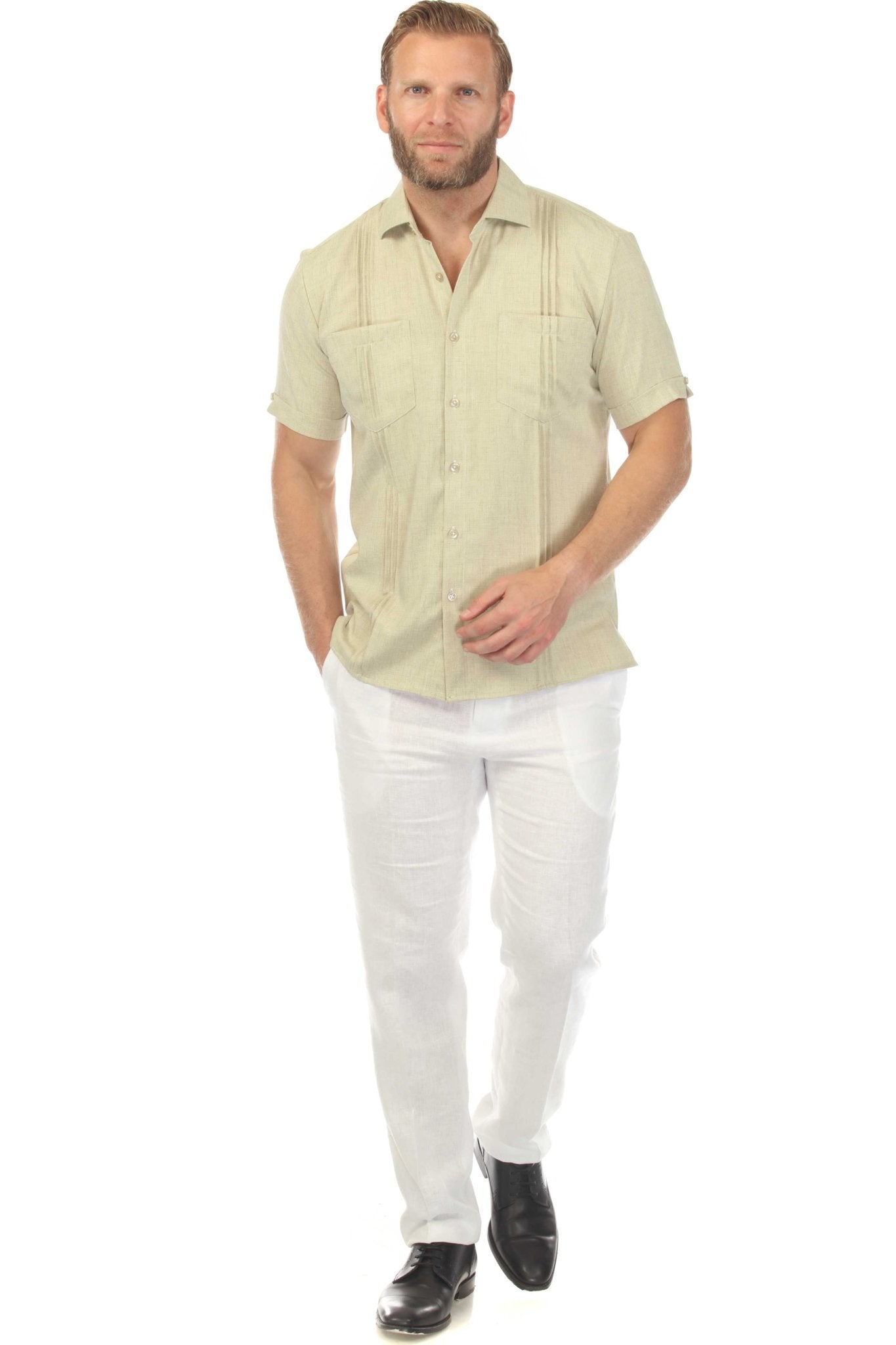 Front view of a man wearing a light green Men’s Classic Two-Pocket Guayamisa Shirt with Pleats.