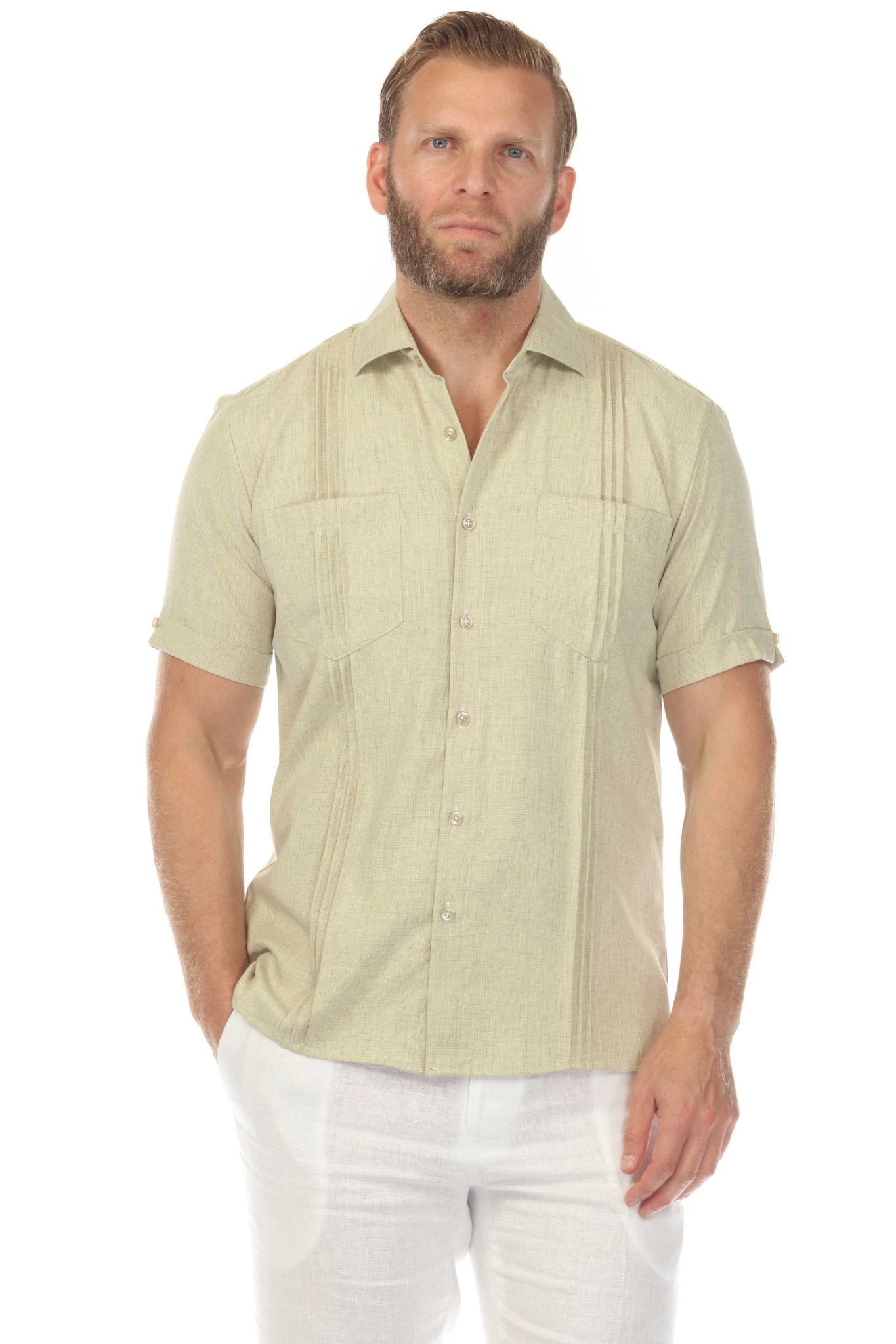 Front view of a man wearing a tan Men’s Classic Two-Pocket Guayamisa Shirt with Pleats.