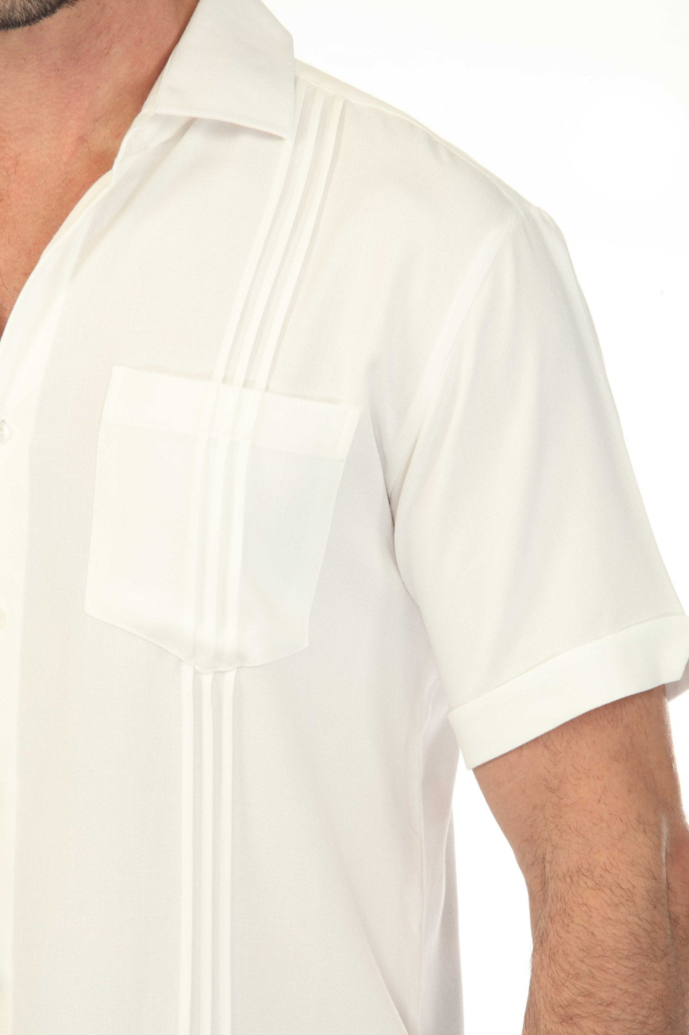 Close-up of a white Men’s Classic Two-Pocket Guayamisa Shirt with Pleats detail.