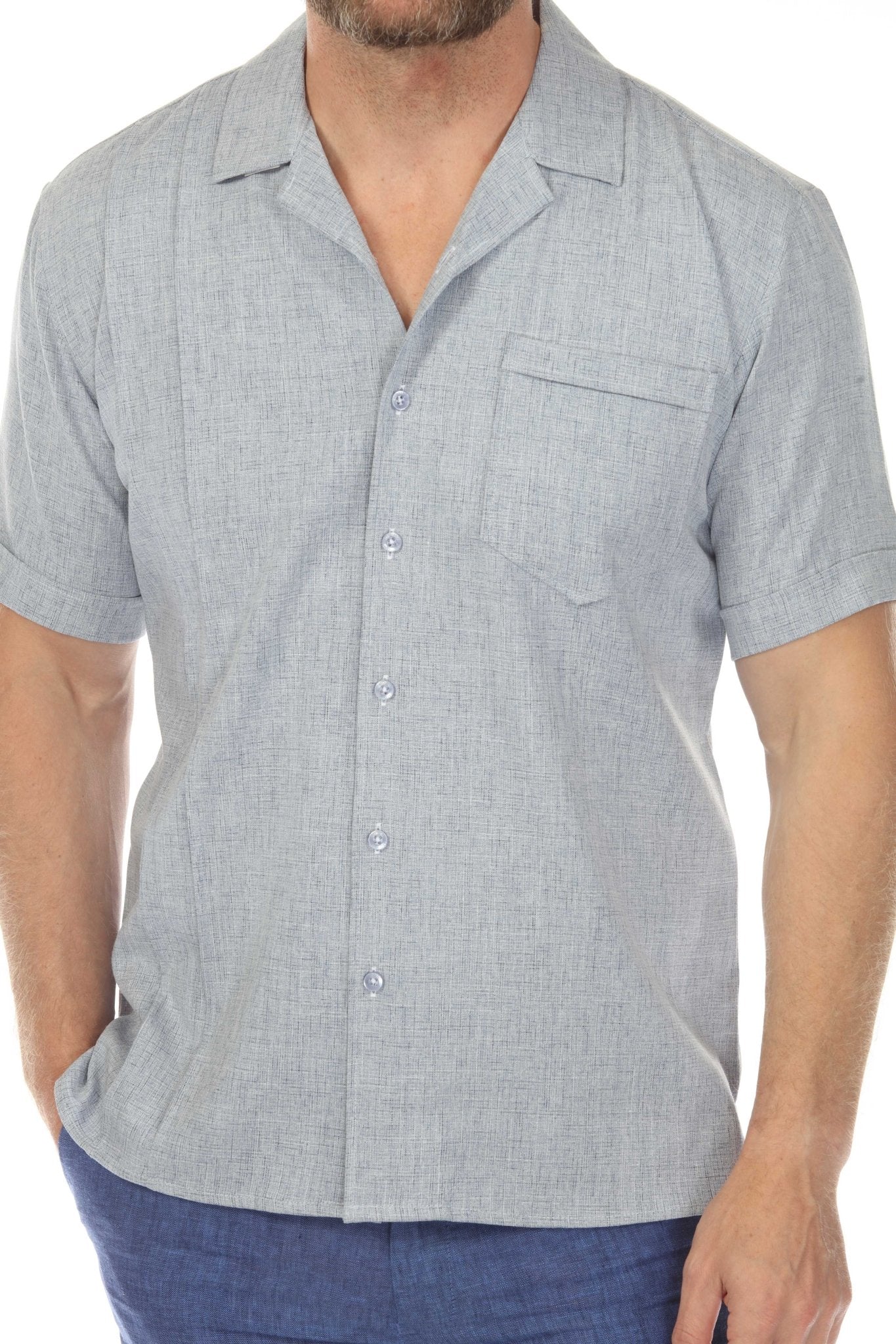 Mid shot of a man in a light blue Menâ€™s Retro Cuban Shirt with a classic one pocket and short sleeves.