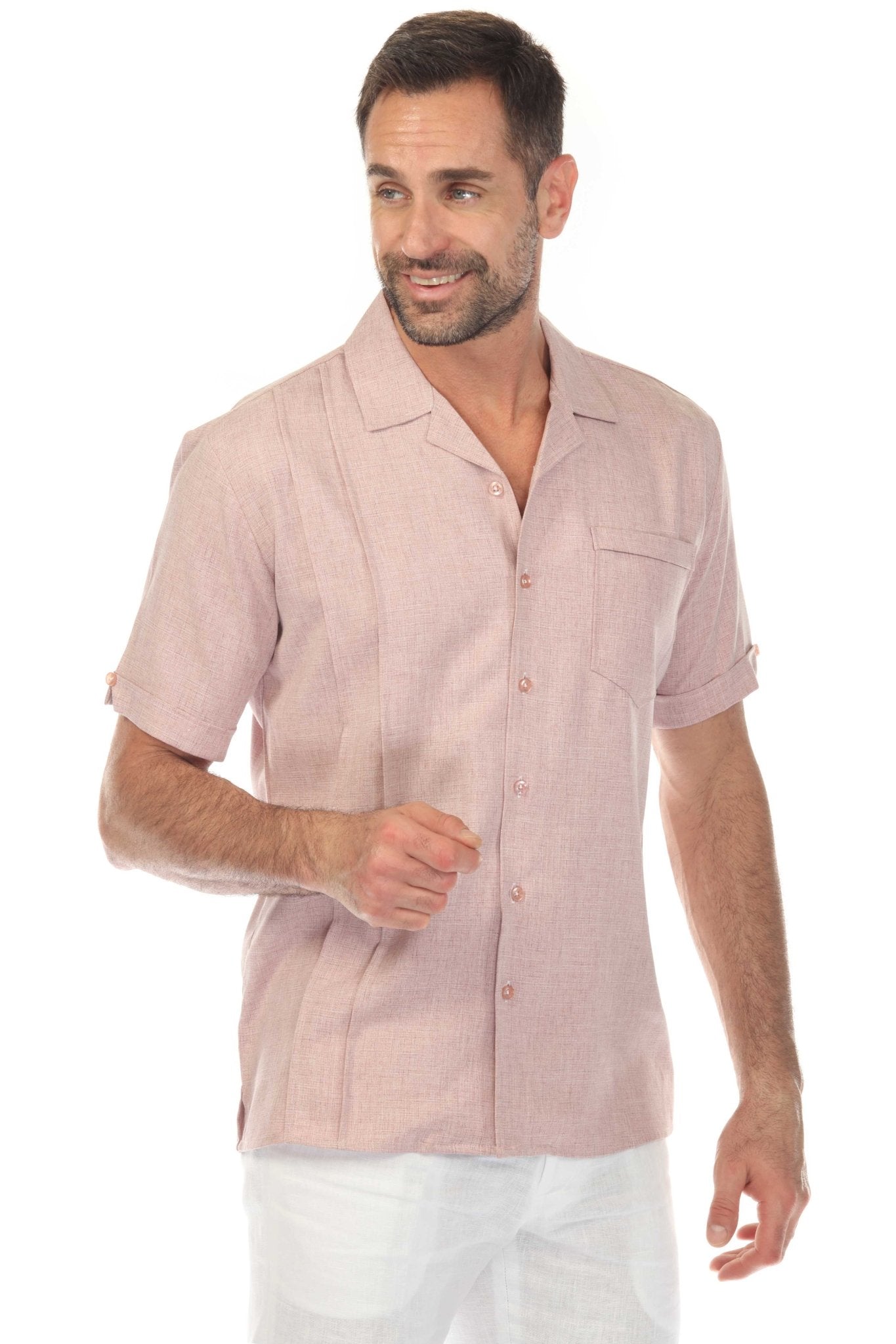 A man wears the pink Menâ€™s Retro Cuban Shirt with pleating and one pocket.