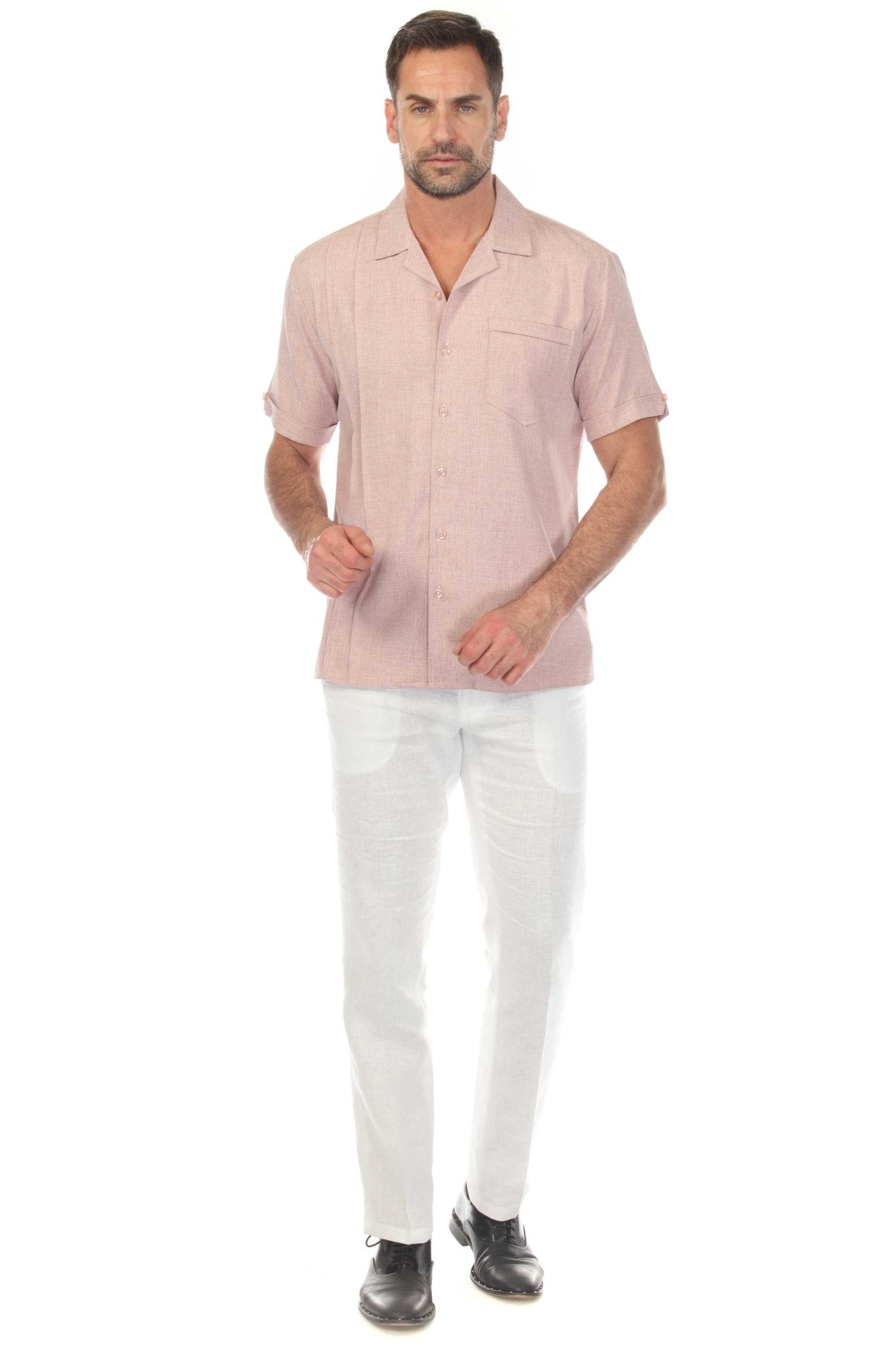 Front view of a man wearing the Menâ€™s Retro Cuban Shirt in salmon, with pleating detail and a single pocket.