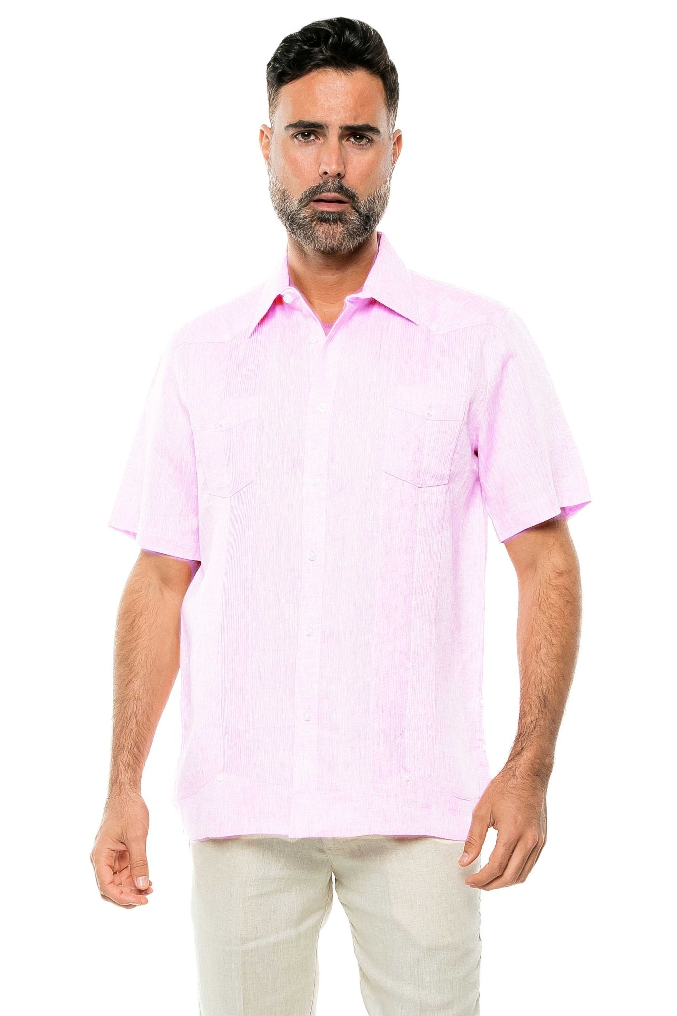 A man wears a pink Yarn Dye 100% Linen Two Pocket Guayabera Short Sleeve shirt, shown from the front.