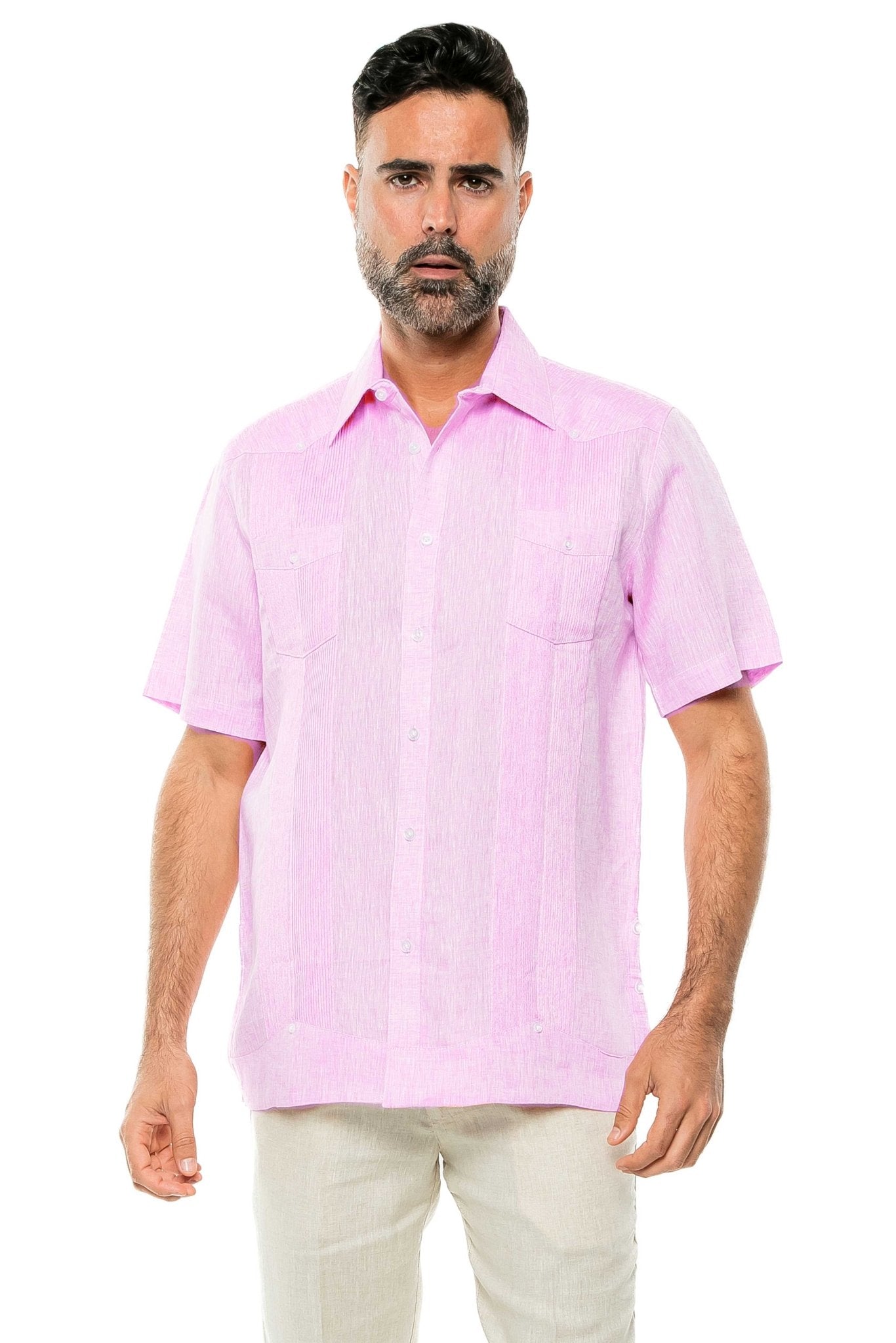 Front view of a man modeling the yarn dye pink 100% linen, two-pocket, short sleeve Guayabera shirt.