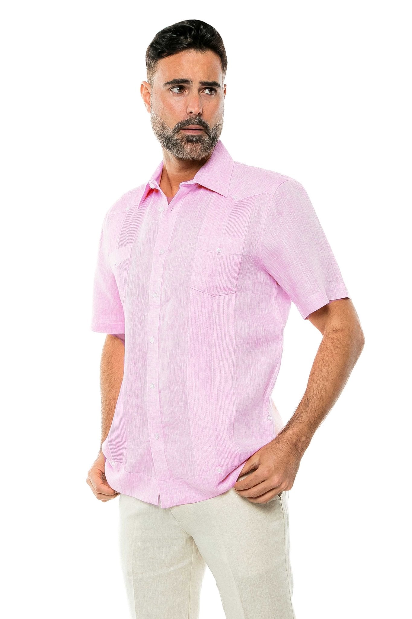 A man wears a pink Yarn Dye 100% Linen Two Pocket Guayabera Short Sleeve shirt, front view.
