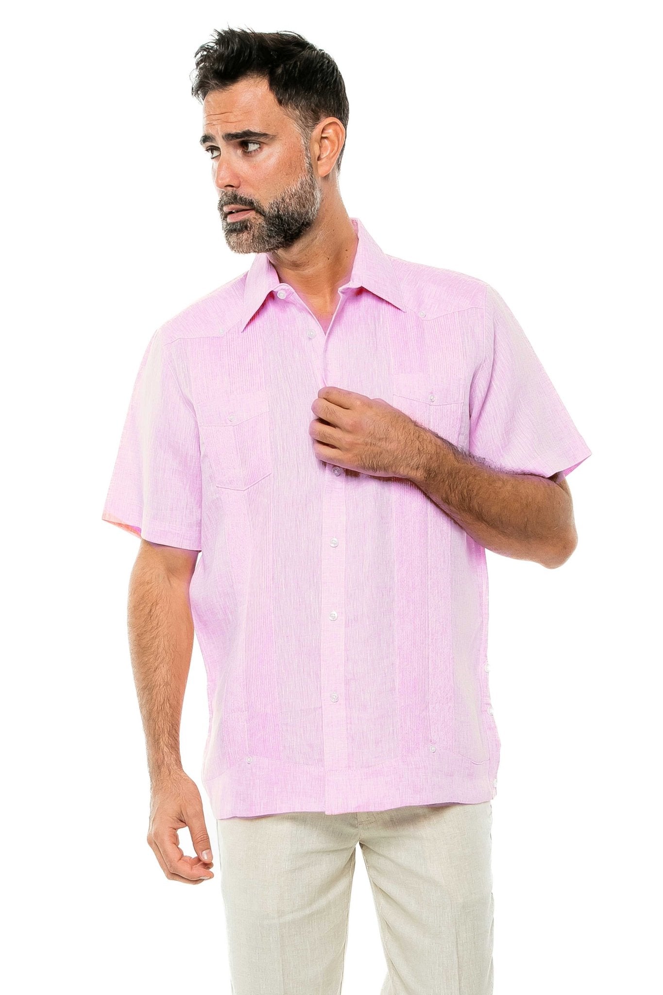 A man models the pink Yarn Dye 100% Linen Two Pocket Guayabera Short Sleeve shirt; the two pockets are visible on the chest.