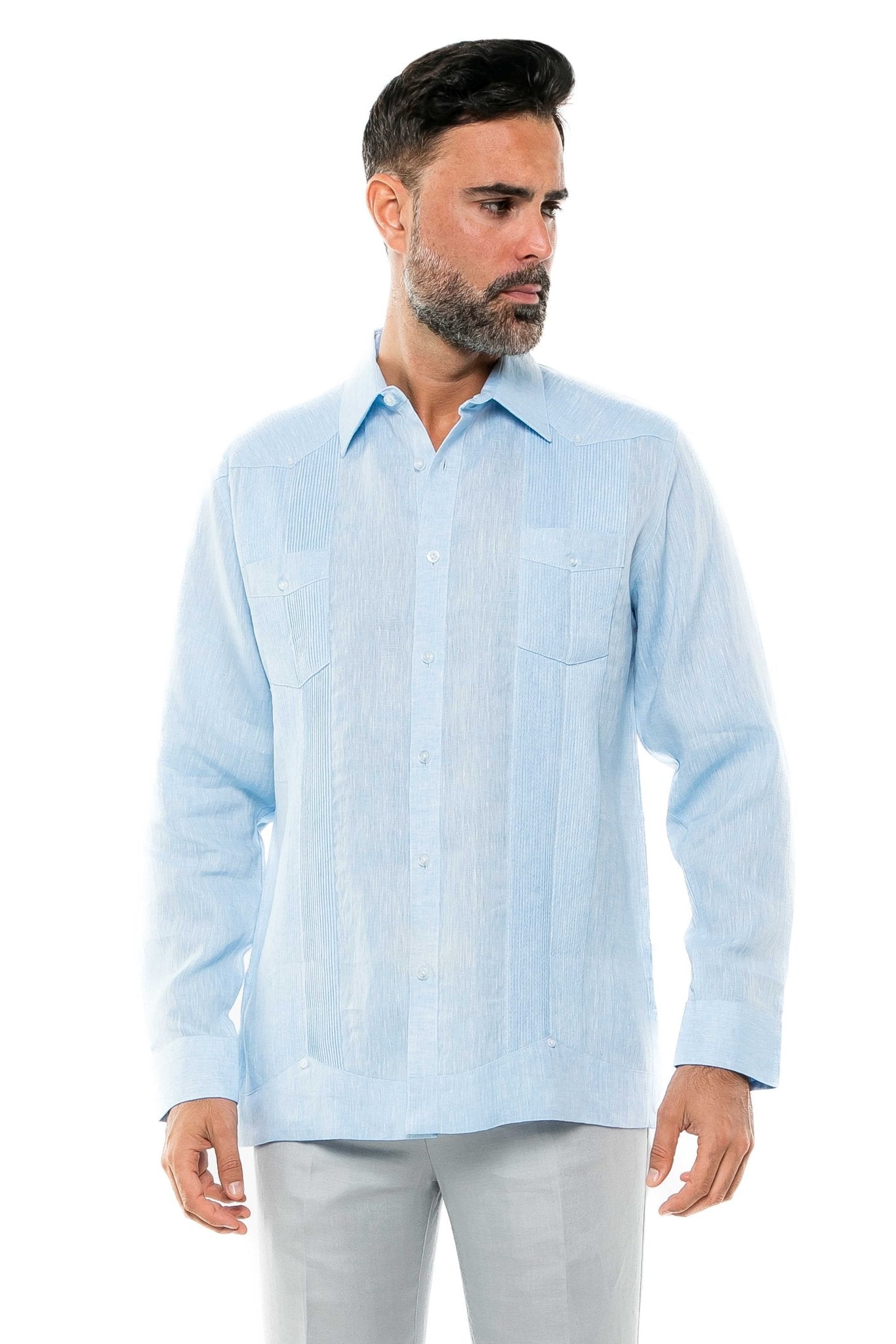 Man wearing a light blue, long-sleeved 100% Linen Yarn Dyed Two Pocket Guayabera Shirt.