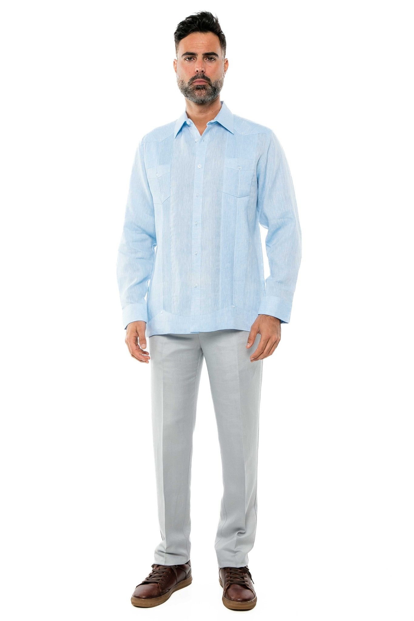 A man wears a long sleeve, light blue, 100% Linen Yarn Dyed Two Pocket Guayabera Shirt, frontal view.