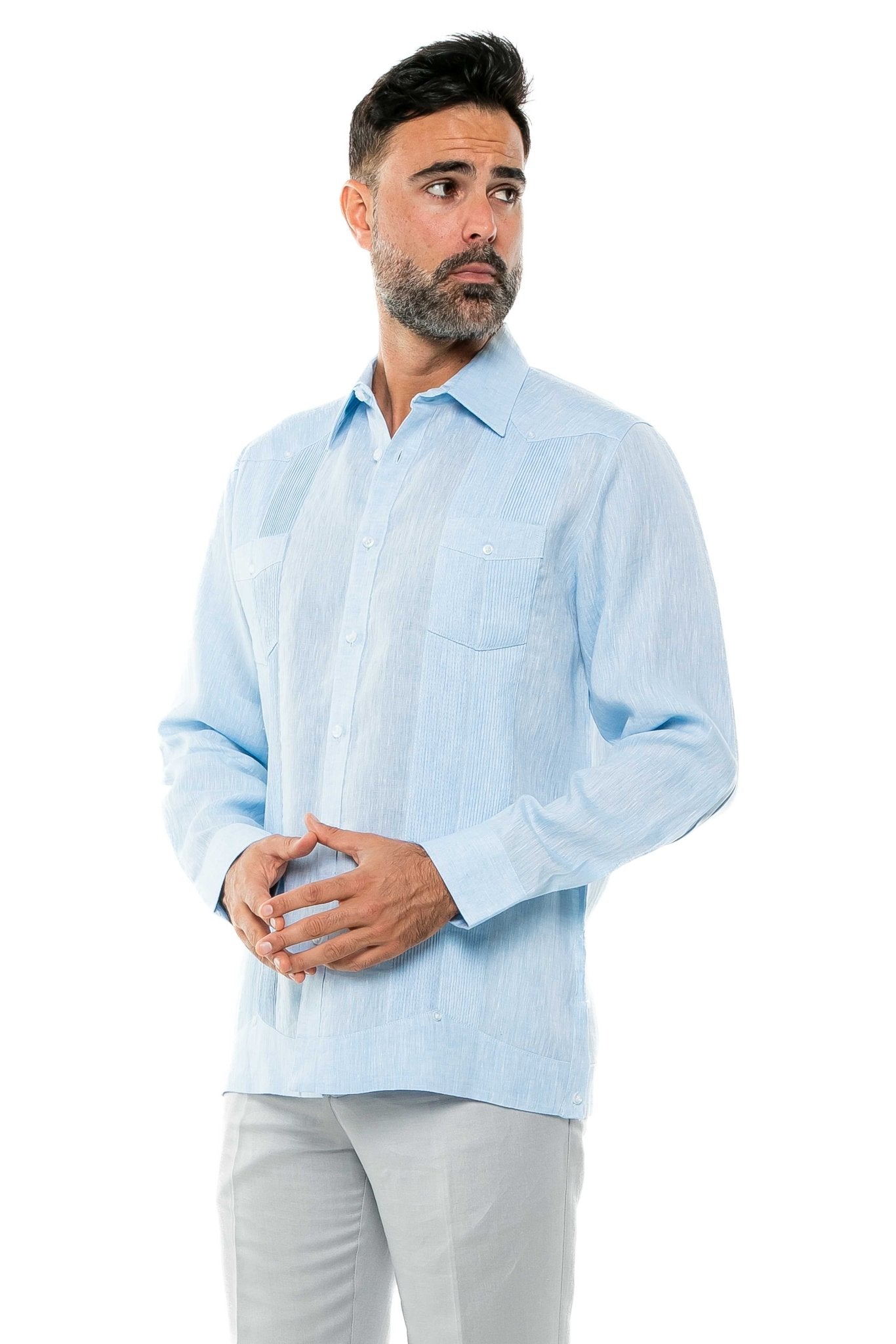 Man wearing a light blue, long sleeve 100% Linen Yarn Dyed Two Pocket Guayabera Shirt.