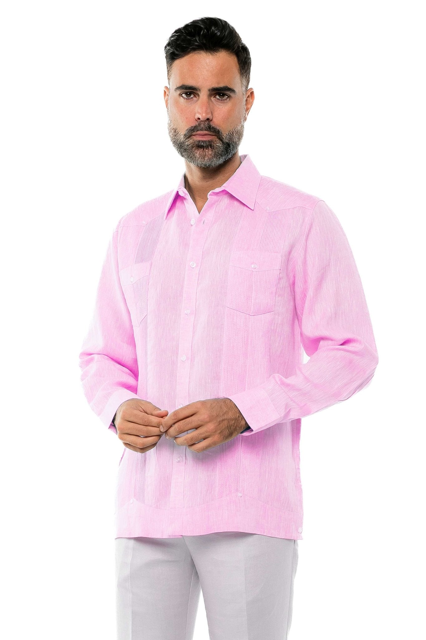 Front view of a man wearing a pink, long sleeve 100% Linen Yarn Dyed Two Pocket Guayabera Shirt.