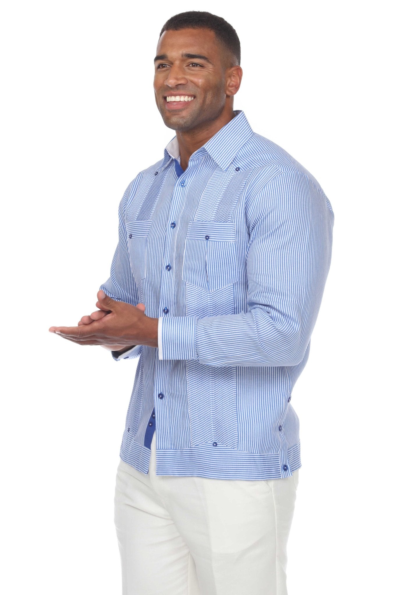 Man wearing a blue striped 100% Linen Contrast Panel Guayabera Shirt Long Sleeve with white pants.