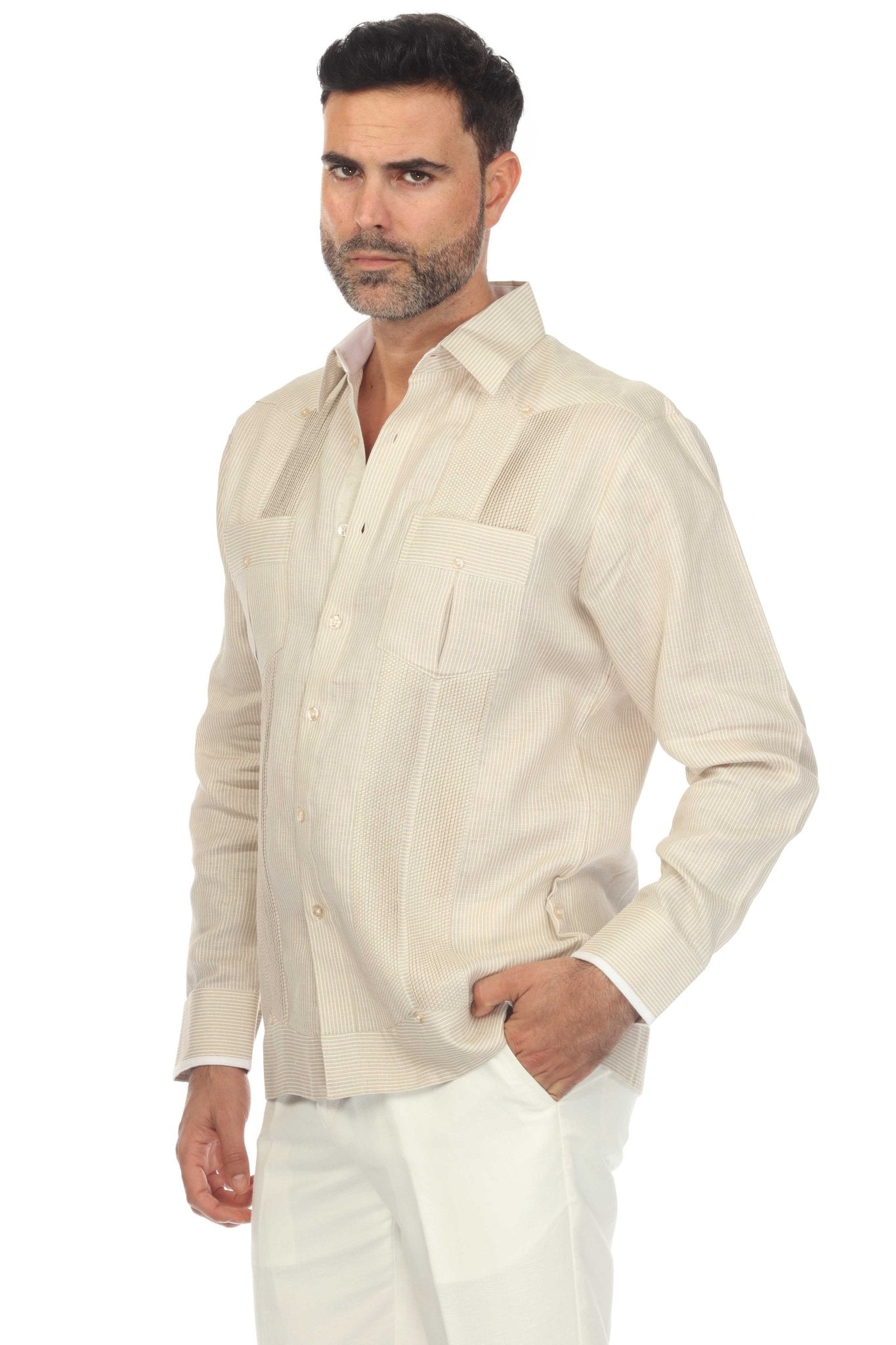 A man wears a full view of a long-sleeve, off-white 100% Linen Contrast Panel Guayabera Shirt.