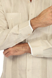 Close-up of a sand colored, long sleeve 100% Linen Contrast Panel Guayabera Shirt, displaying contrast piping on the cuffs.