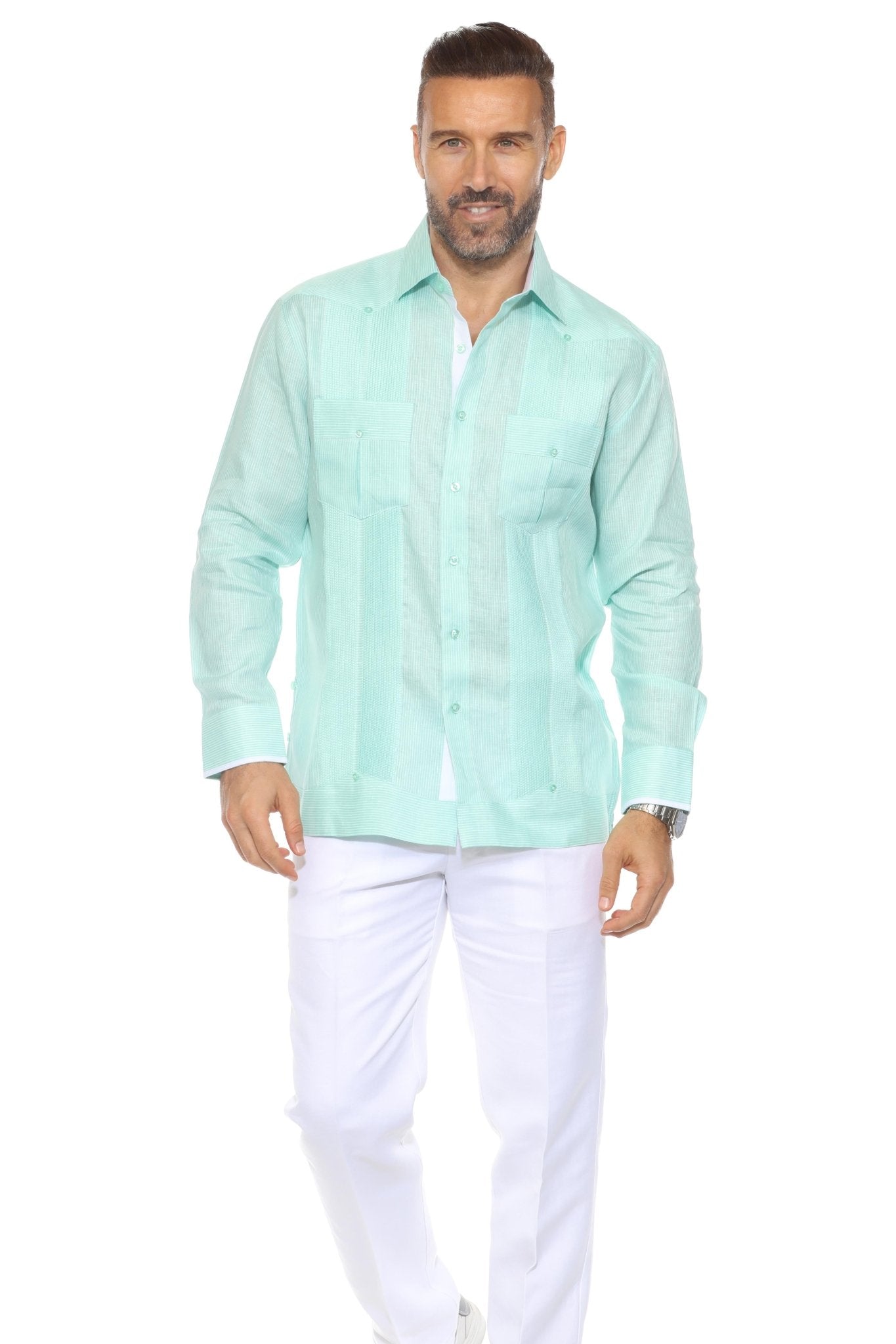 Front view of a man wearing a light green 100% Linen Contrast Panel Guayabera Shirt Long Sleeve and white pants.