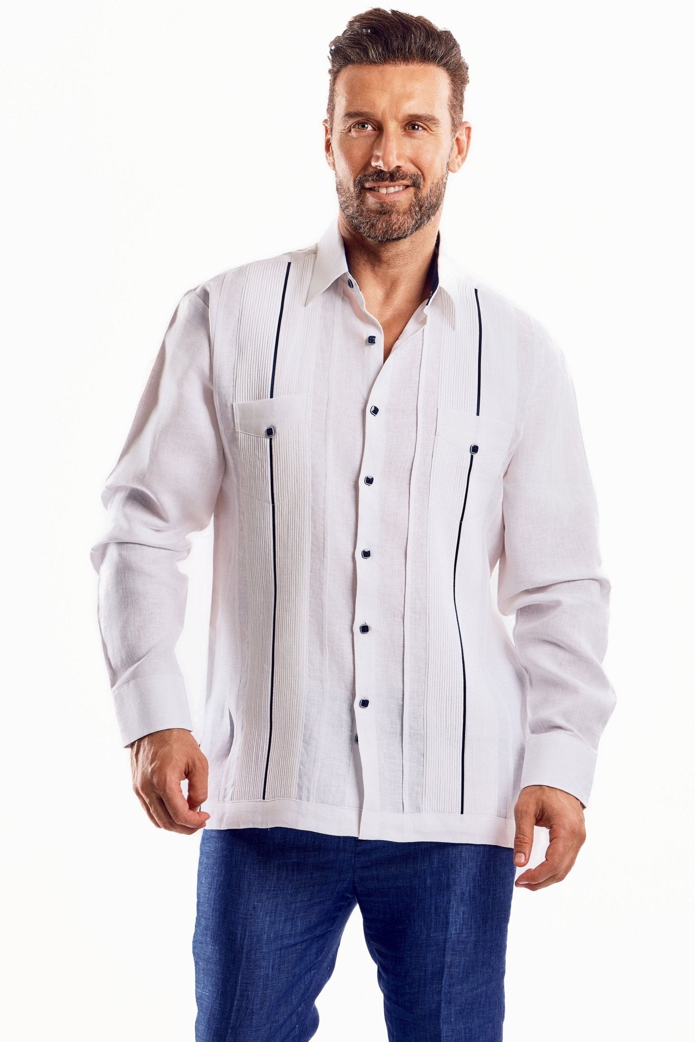 A man wearing a white, long-sleeved, plus size linen Guayabera shirt with dark contrast trim.