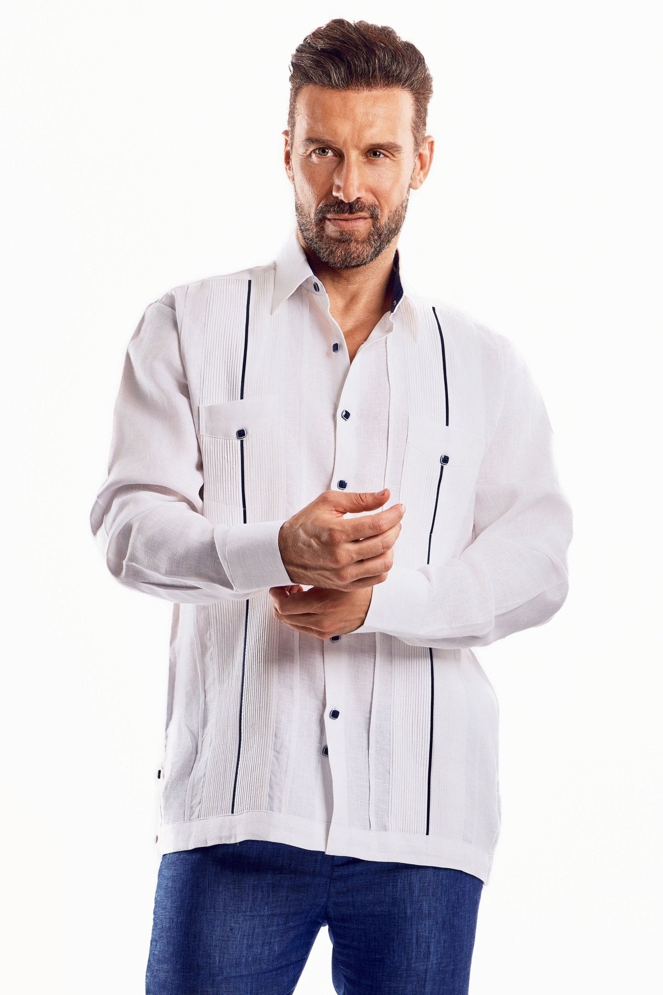 Model wearing a white Men's Linen Plus Size Guayabera Shirt with long sleeves and dark trim.