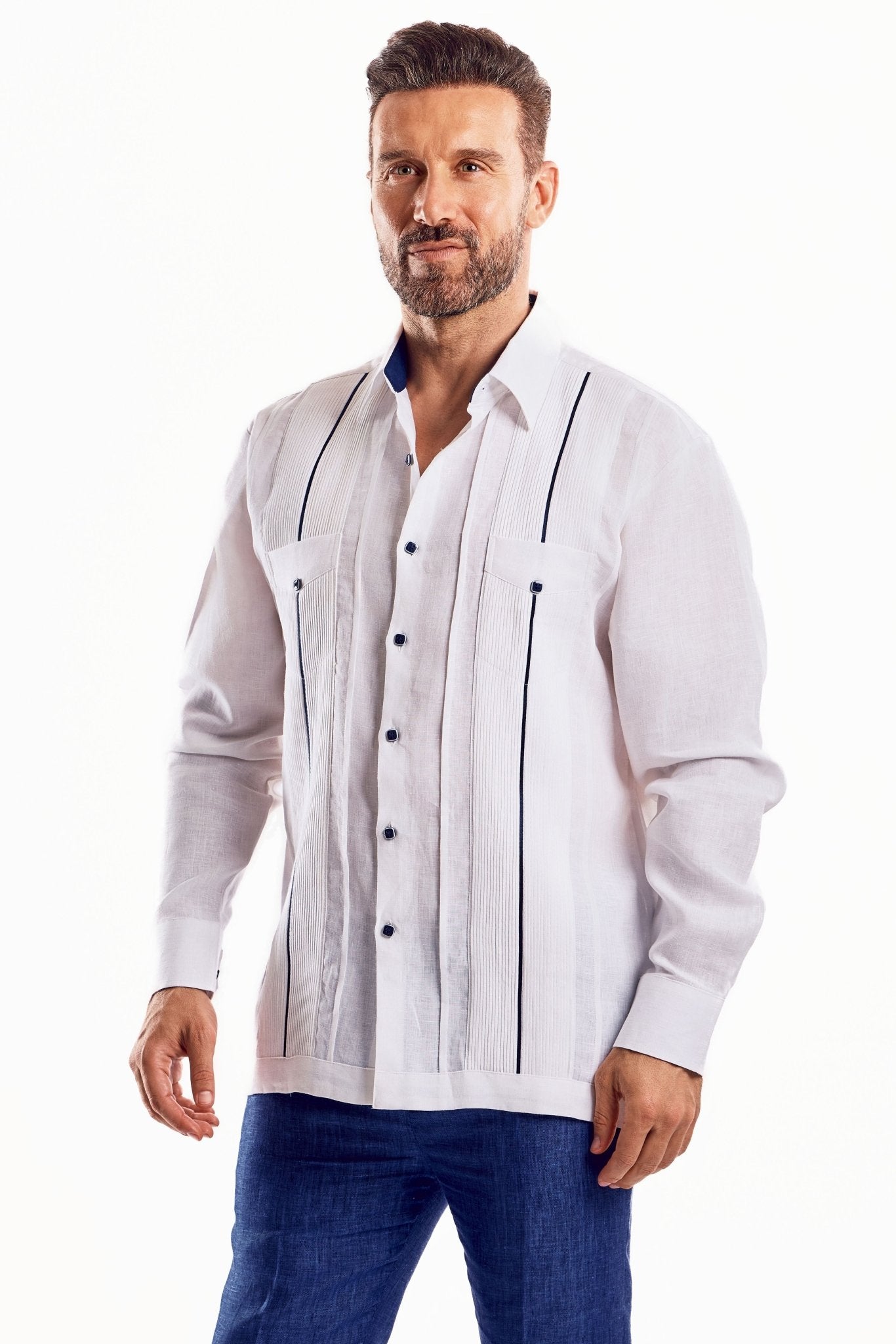 Front view of a man wearing a white, long-sleeved Men's Linen Plus Size Guayabera Shirt, showing contrast trim.