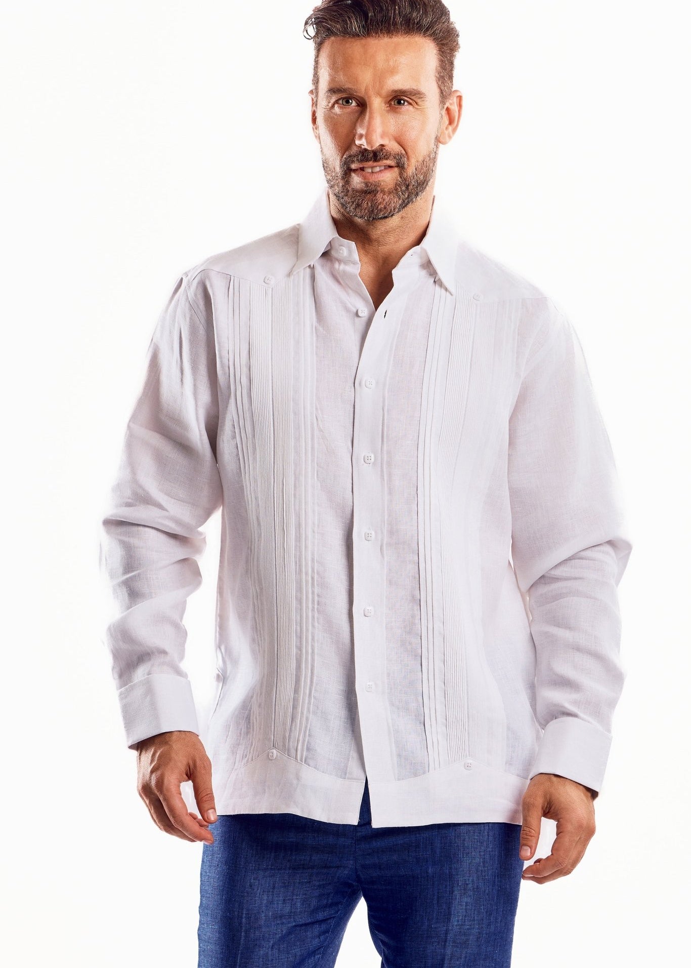 A man wears a white, long-sleeve Men's Linen Formal Guayabera shirt with pleated front and French cuffs.