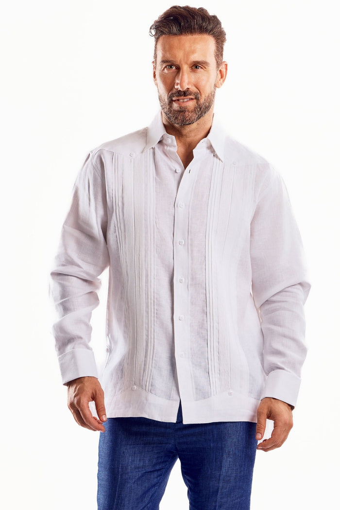 A man adjusting the cuff of a beige Men's Linen Formal Guayabera Long Sleeve Pleated Shirt.