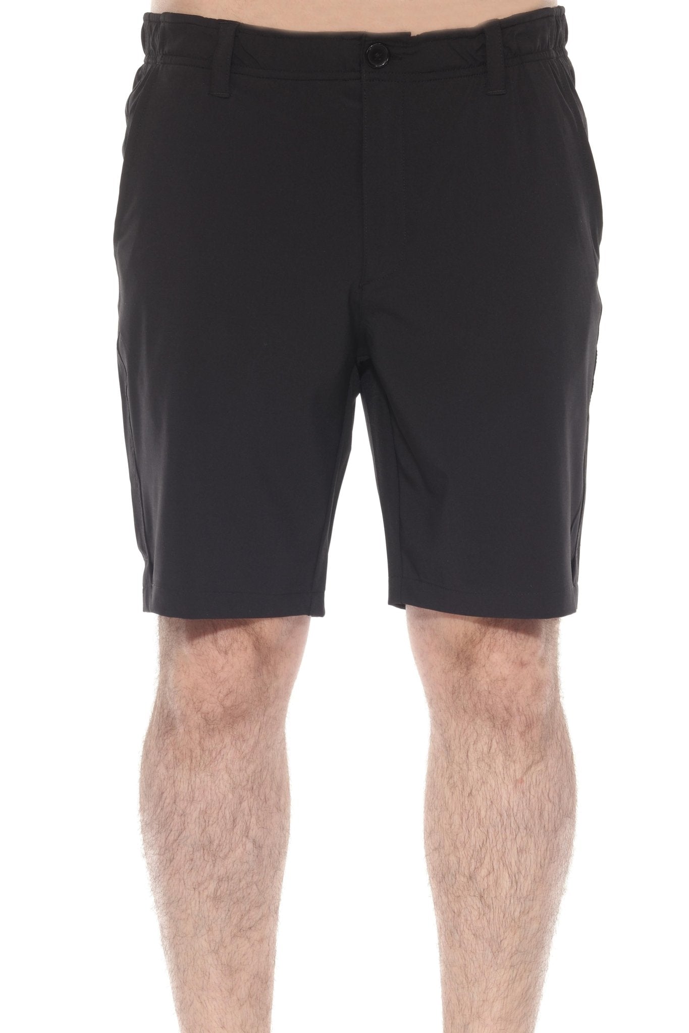 A man wears the black Men’s Dri-Fit Stretch Performance Shorts, shown from the front, waist to mid-thigh view.