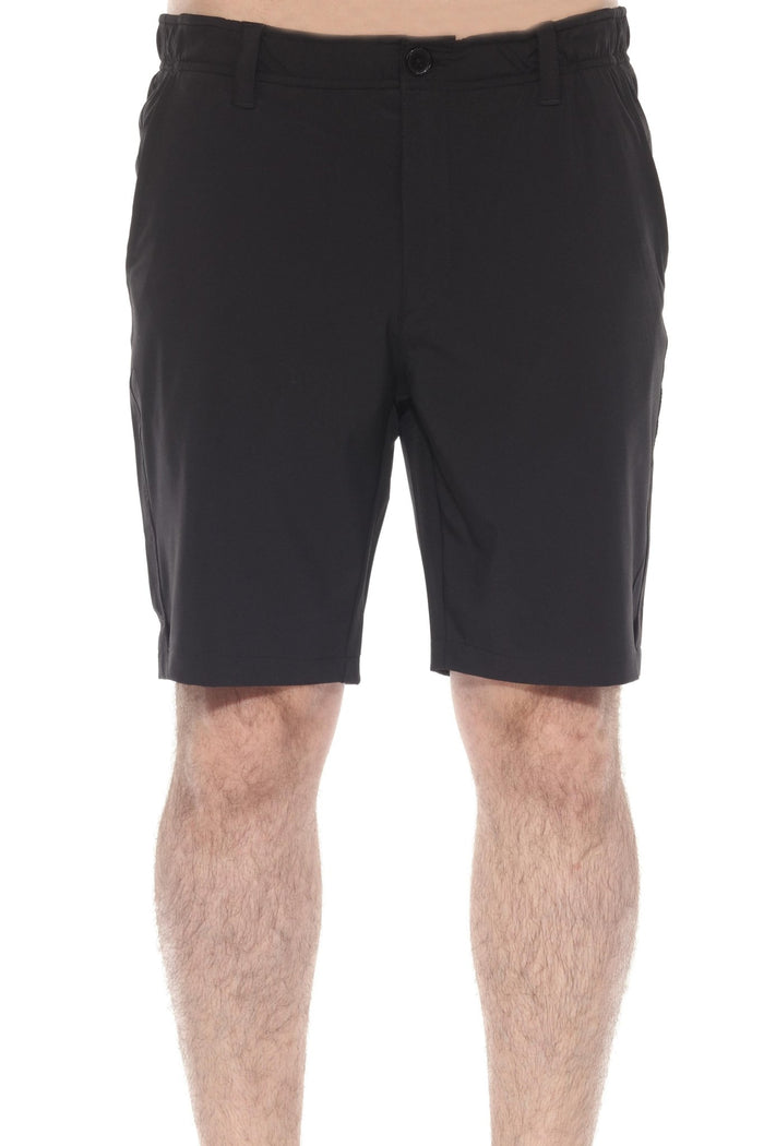 Close up of a model wearing khaki Men’s Dri-Fit Stretch Performance Shorts for Resort &amp; Golf.