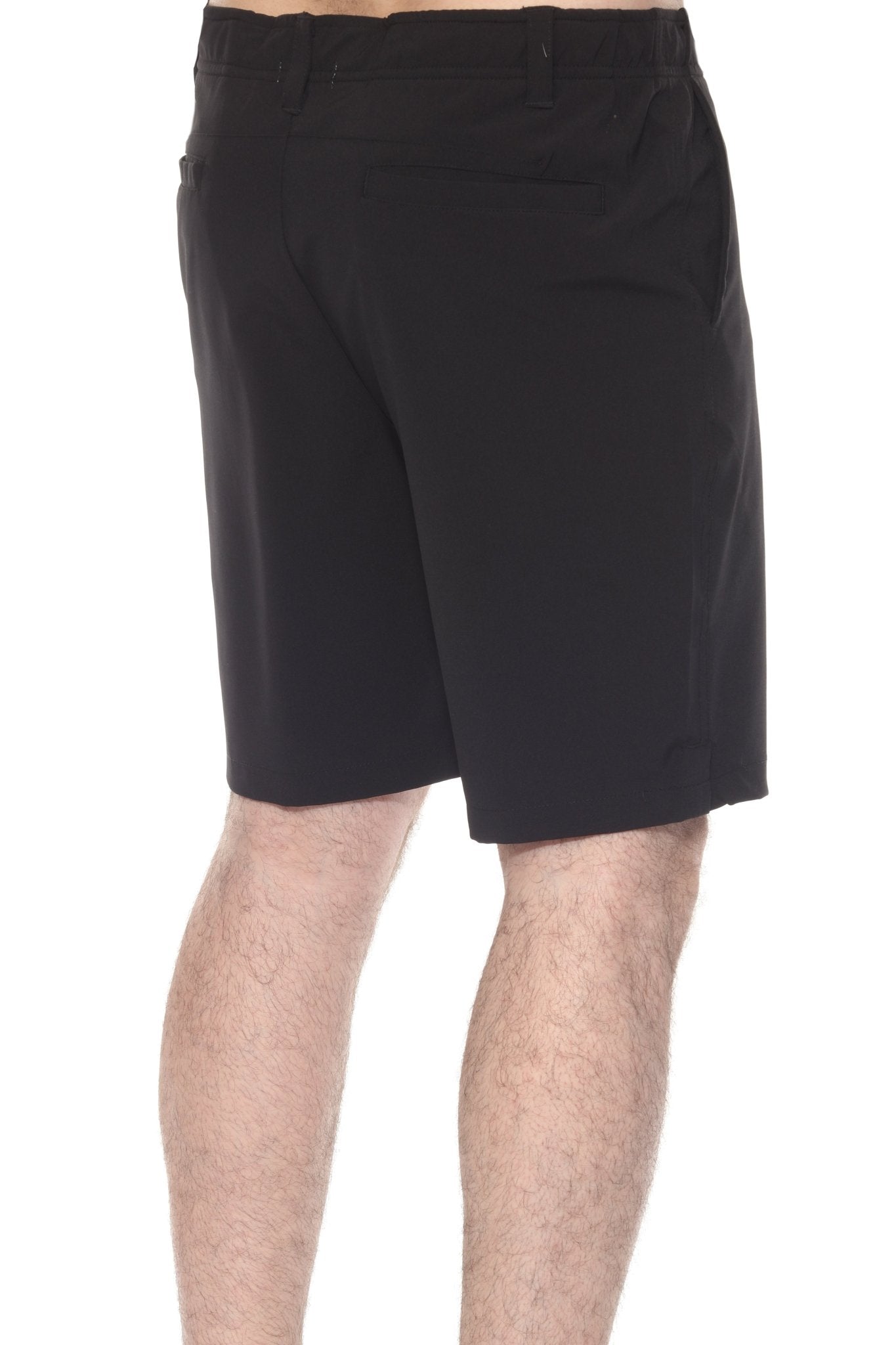 Side view of a person wearing black Men’s Dri-Fit Stretch Performance Shorts with a back pocket detail.