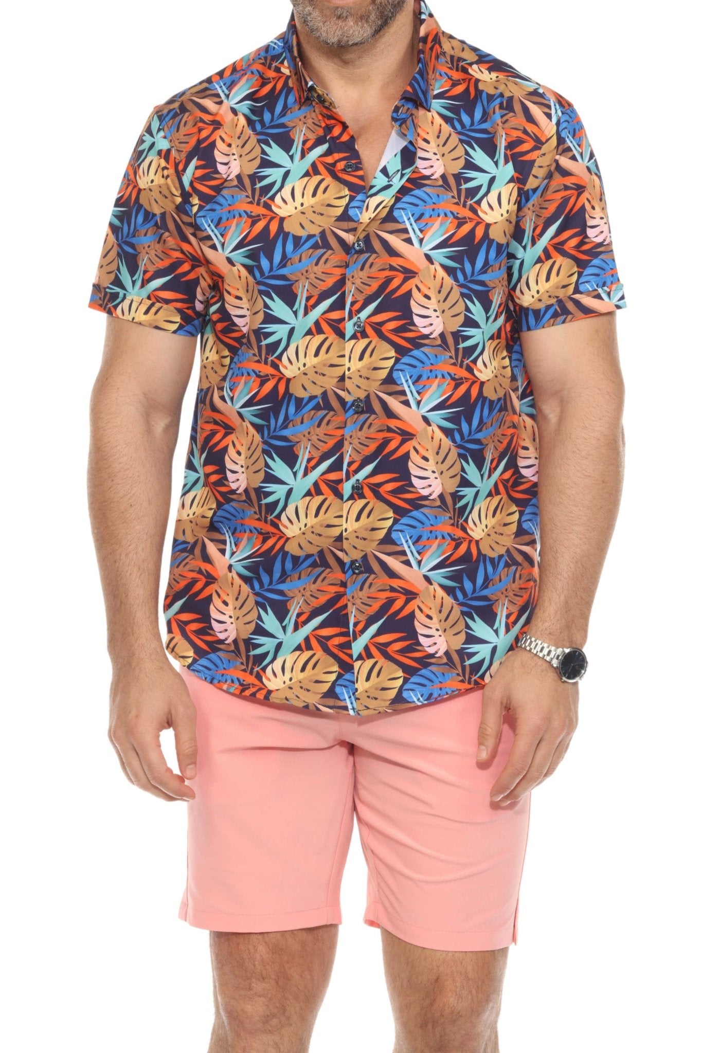 Man wears floral shirt and peach Men’s Dri-Fit Stretch Performance Shorts.