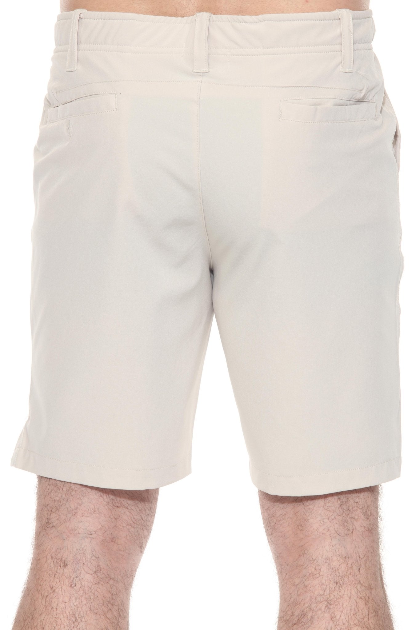 Back view of a person wearing the Men’s Dri-Fit Stretch Performance Shorts in light khaki, showing pockets.