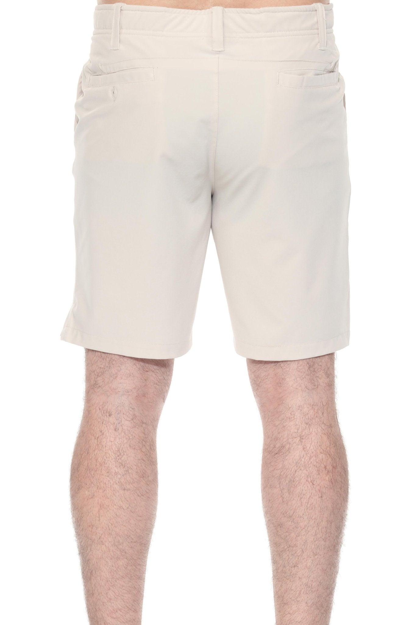 Back view of a person wearing khaki Men’s Dri-Fit Stretch Performance Shorts, showing back pocket detail.