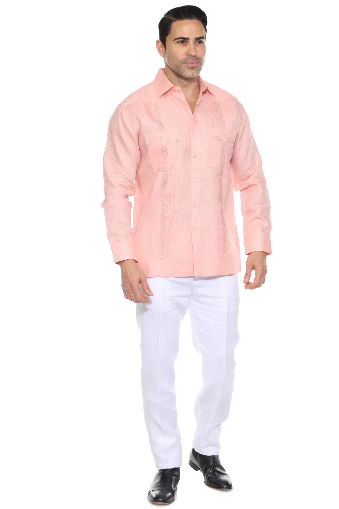 Men's salmon linen embroidered guayabera long sleeve, full-length front view with white pants and black shoes, studio
