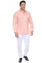 Men's salmon linen embroidered guayabera long sleeve, full-length front view with white pants and black shoes, studio