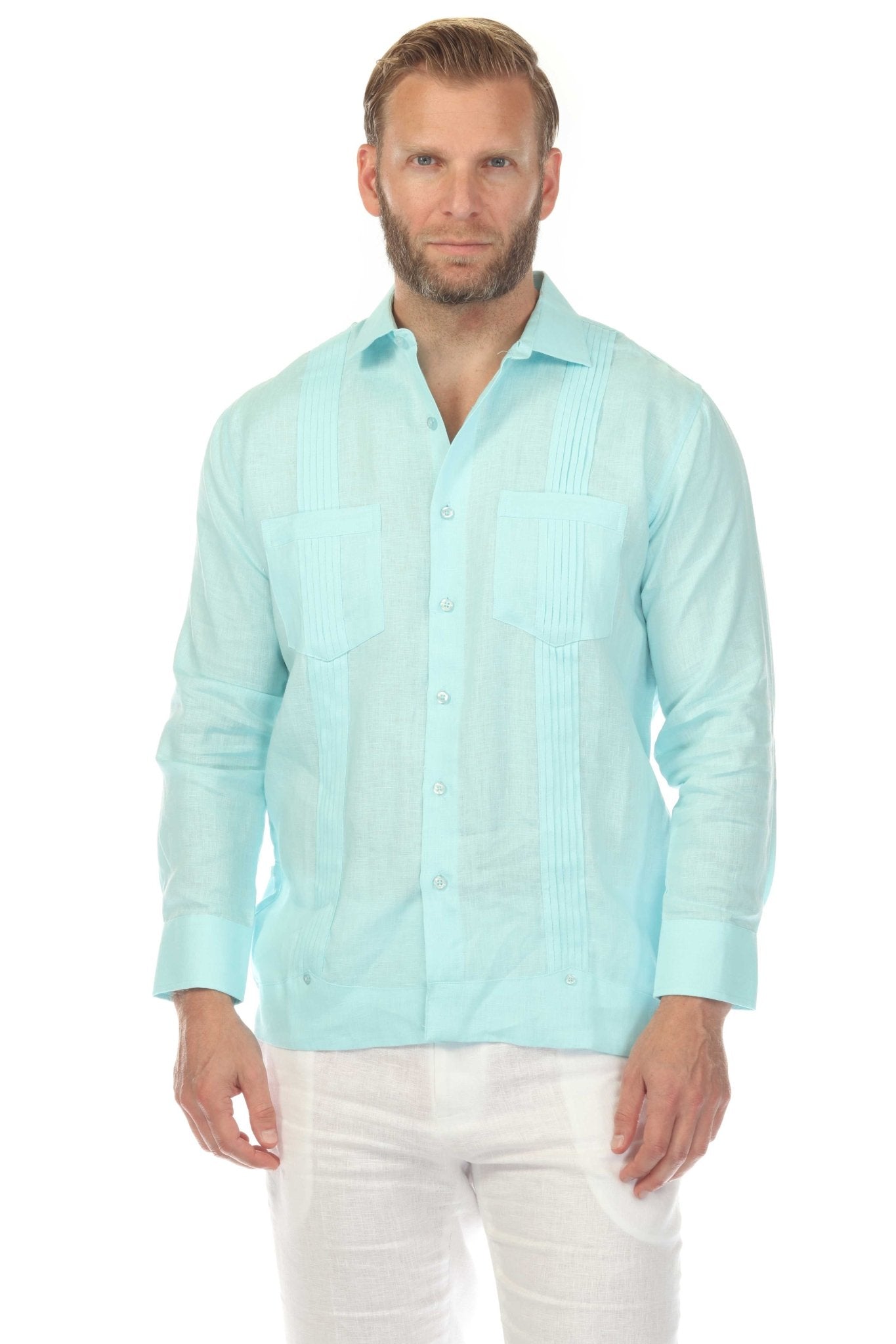 Front view of a man wearing a light blue men’s premium linen two-pocket guayabera shirt.