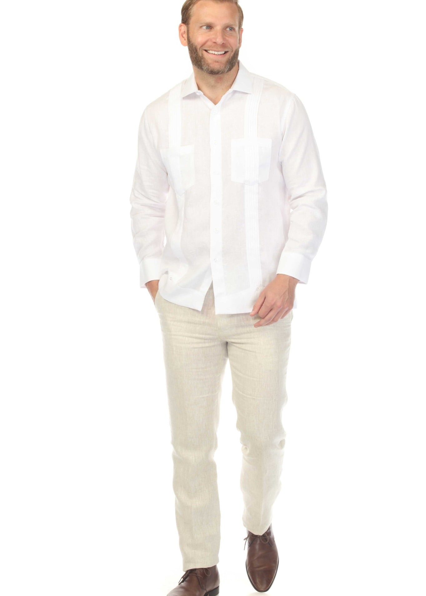 A man models the white, long-sleeved Men’s Premium Linen Two-Pocket Guayabera Shirt with tuxedo-inspired pleats.