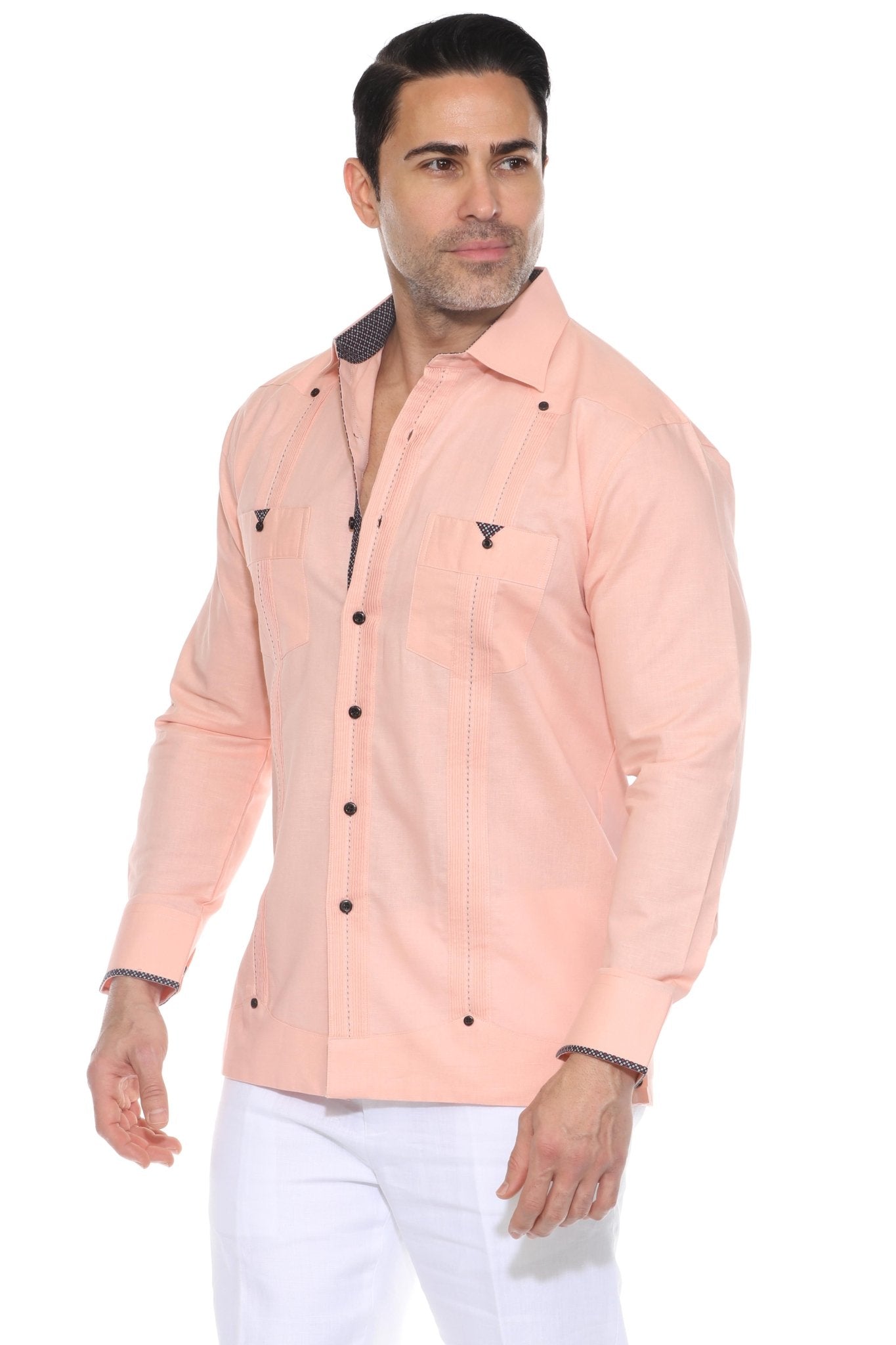 A studio shot of a different man wearing the peach Men’s Long Sleeve Linen Guayabera Shirt, clearly showing the contrast printed trim inside the collar, cuffs, and pocket edges.