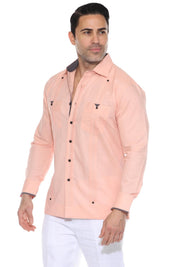 A studio shot of a different man wearing the peach Men’s Long Sleeve Linen Guayabera Shirt, clearly showing the contrast printed trim inside the collar, cuffs, and pocket edges.