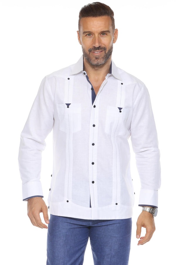 A man wearing a white Men's Long Sleeve Linen Guayabera Cuban Shirt with navy printed trim on the collar and pockets, featuring a classic pleated front.