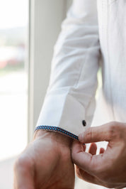 Close-up of the sleeve cuff on a Men's Long Sleeve Linen Guayabera Shirt, featuring the unique blue printed trim accent.