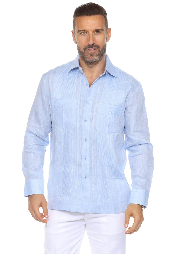 Man wears a red Yarn Dyed Linen Guayabera shirt with multi-pleats and two pockets, and white pants.